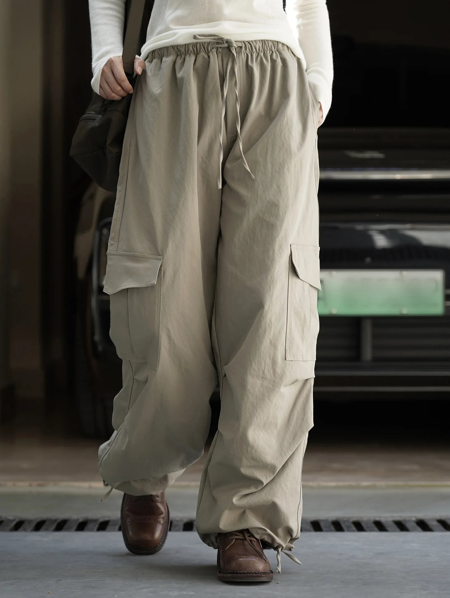 American street workwear style elastic drawstring casual pants with pocket pleats, slightly rolled edge length pants for women